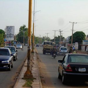 Portrait Advertising Billboard Before Dandima Road Roundabout, Sokoto State