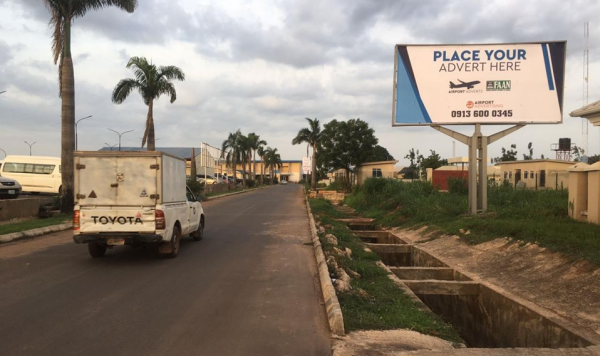 Backlit Billboard By Airport Hotel Fence Facing Traffic, Enugu State