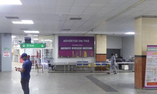 Backlit Billboard by Wall Right Of Exit Gate By Custom Control, International Airport, Lagos State.