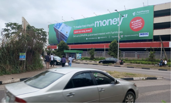 Wall Panel Parking By Lot Facing The Hotel Building Along International Airport - Image 2