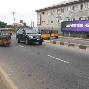 Wall panel Billboard Ipaja Road by water bus stop, Lagos