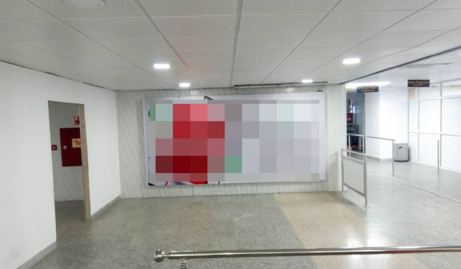 Billboard Left Wall By Passport Control Desk Facing All Arriving Passengers, Airport Lagos .